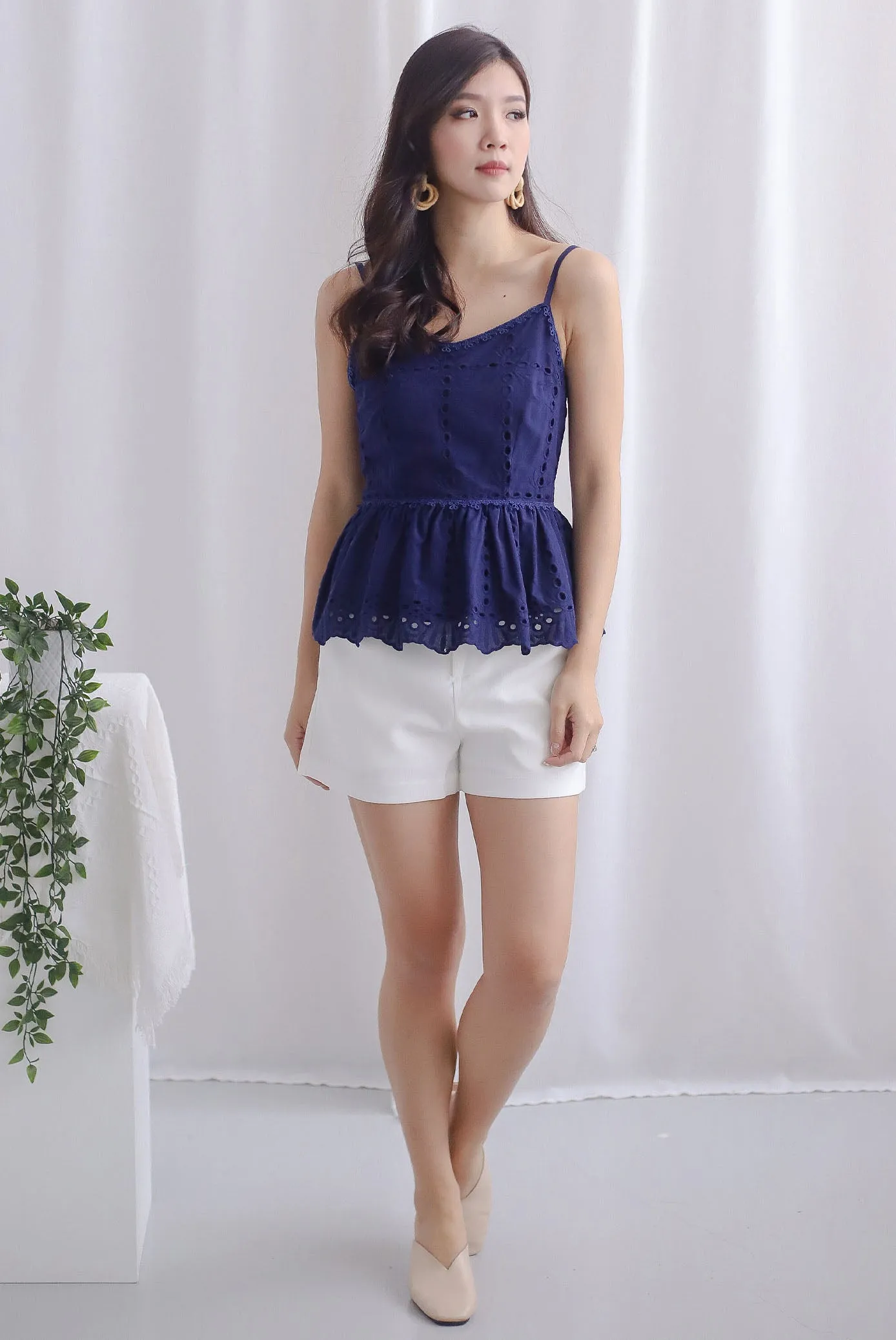 Arelis Eyelet Spag Peplum Top In Navy Blue