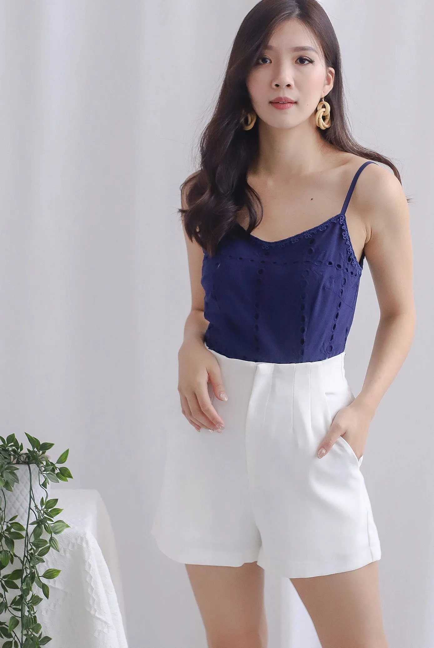 Arelis Eyelet Spag Peplum Top In Navy Blue