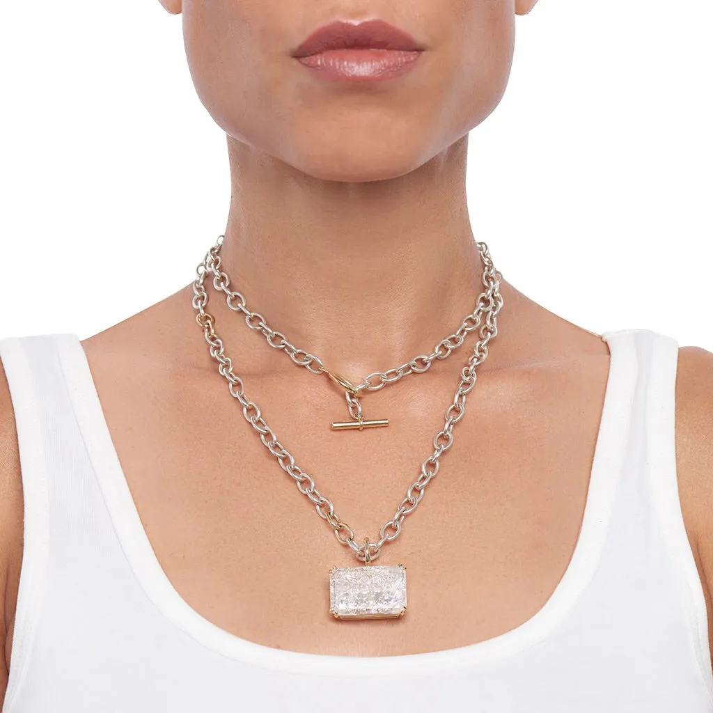 Clear Quartz Pendant on a Bright White and Gold Toggle Chain