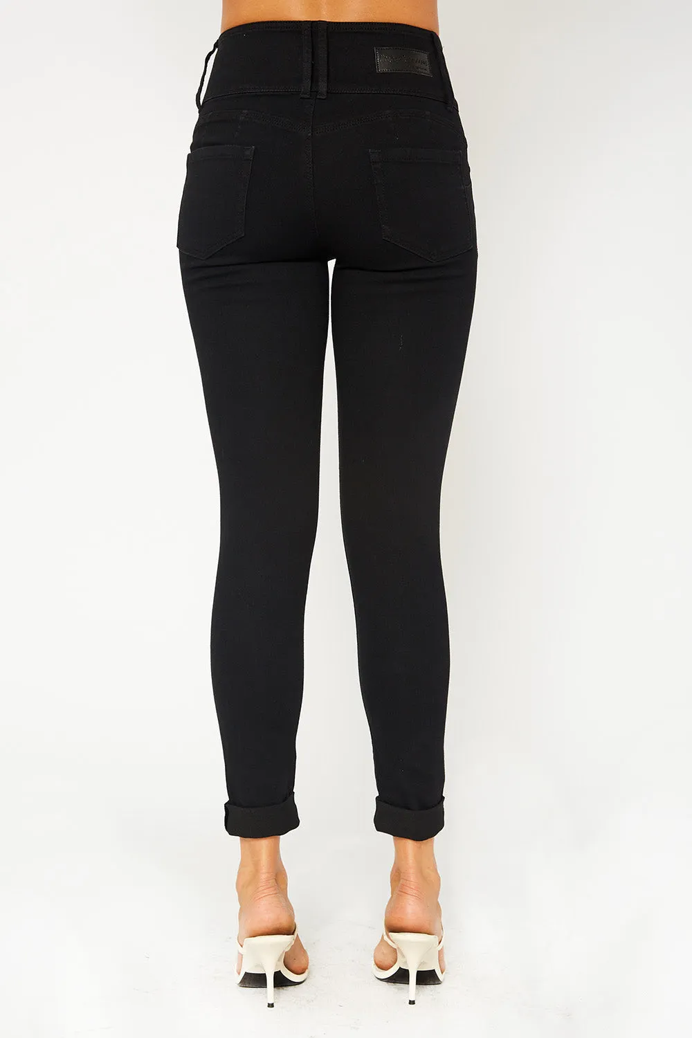 High-rise four button black skinny pants